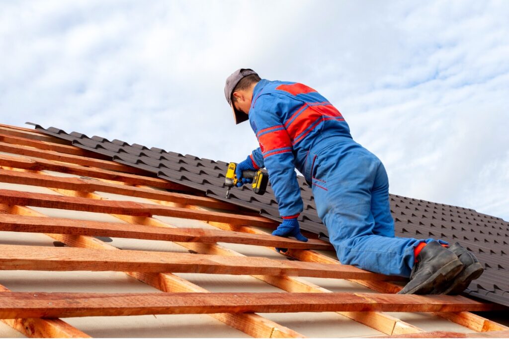Professional Roof Repair Professional roofer replacing damaged shingles on a Florida home