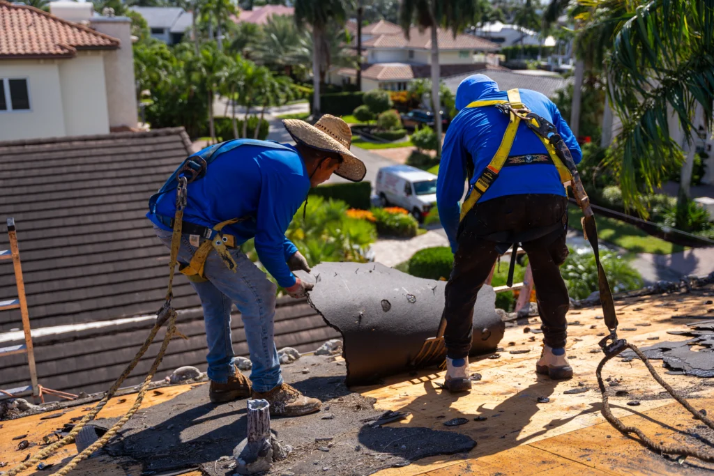 Professional Roof Repair SK Quality Roofing crew repairing damaged shingles on a Florida residential home